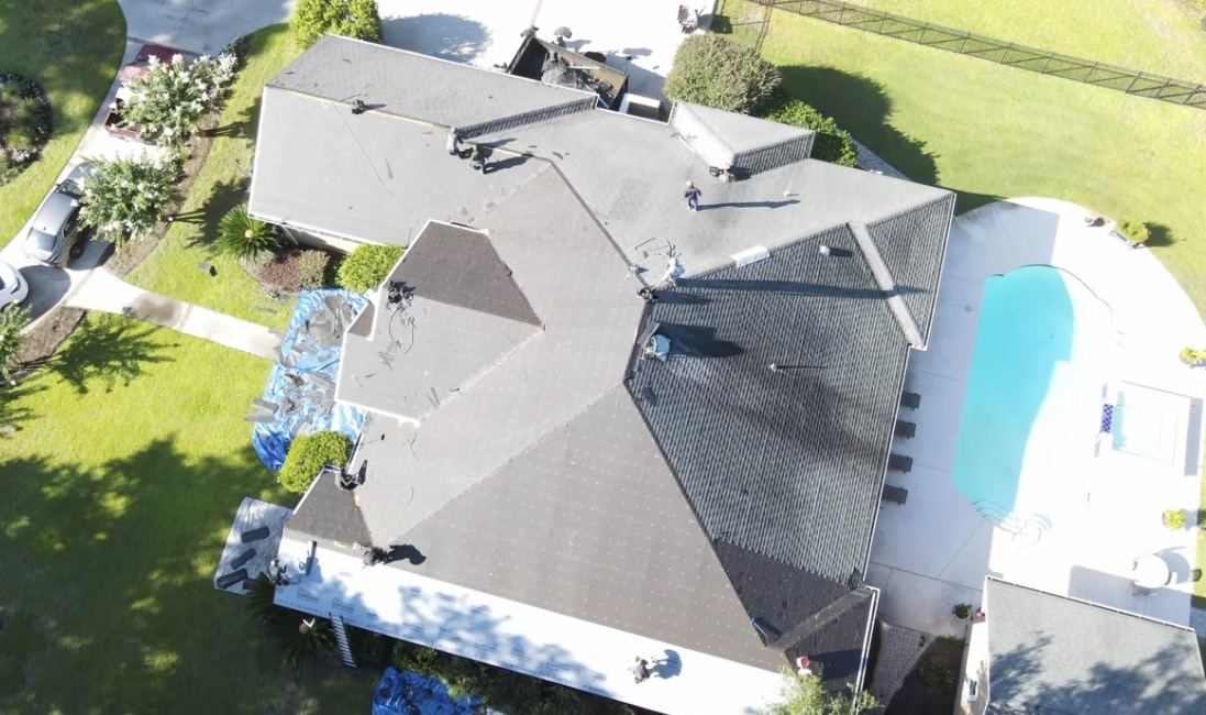 Aerial view of an FEG Construction crew reroofing a home in coastal Georgia